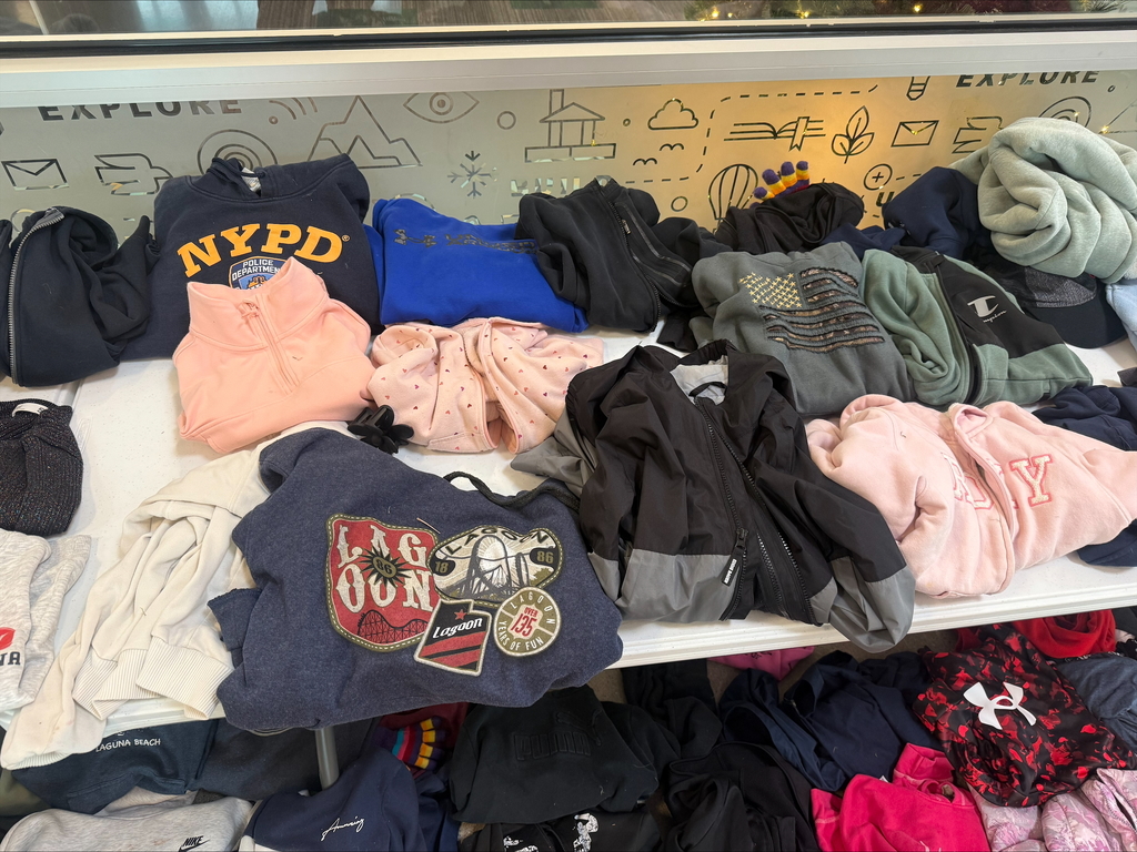 clothing of sweaters with nypd and lagoon on them