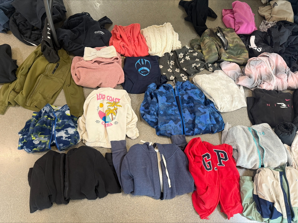 sweaters and coats folded up