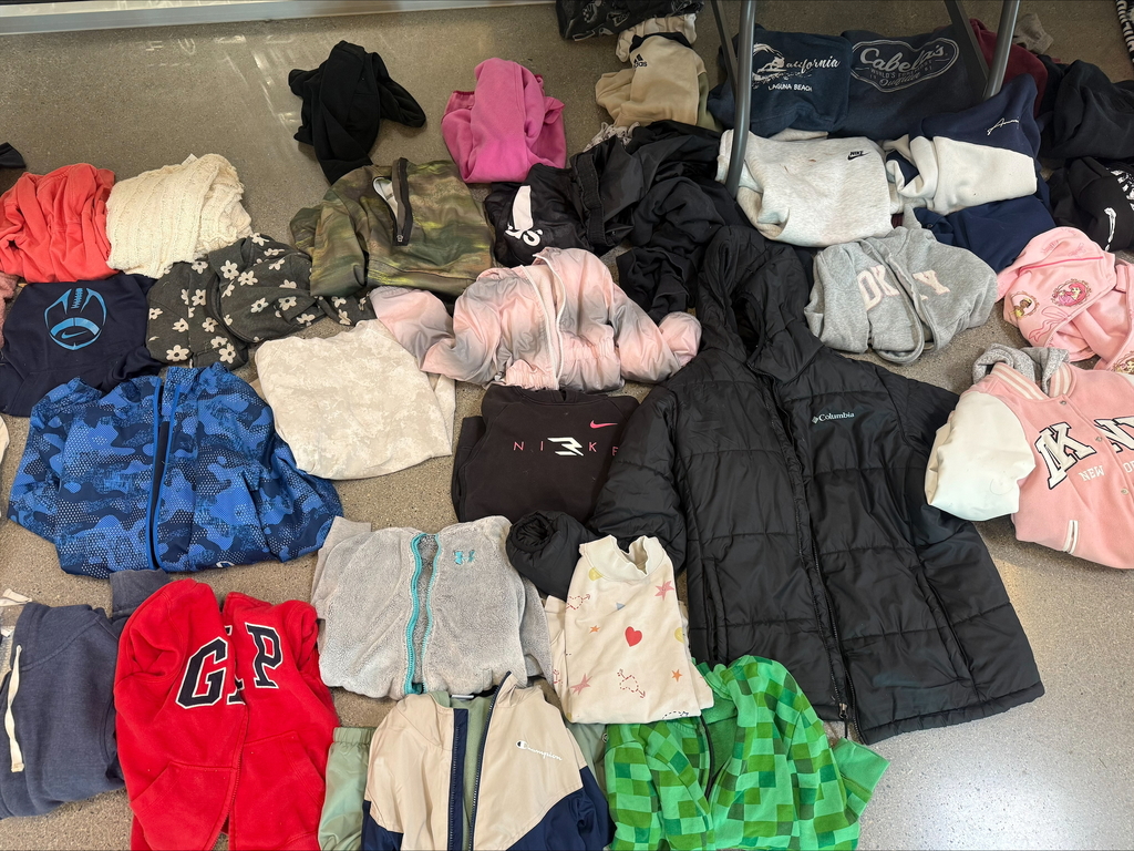 sweaters and coats folded up