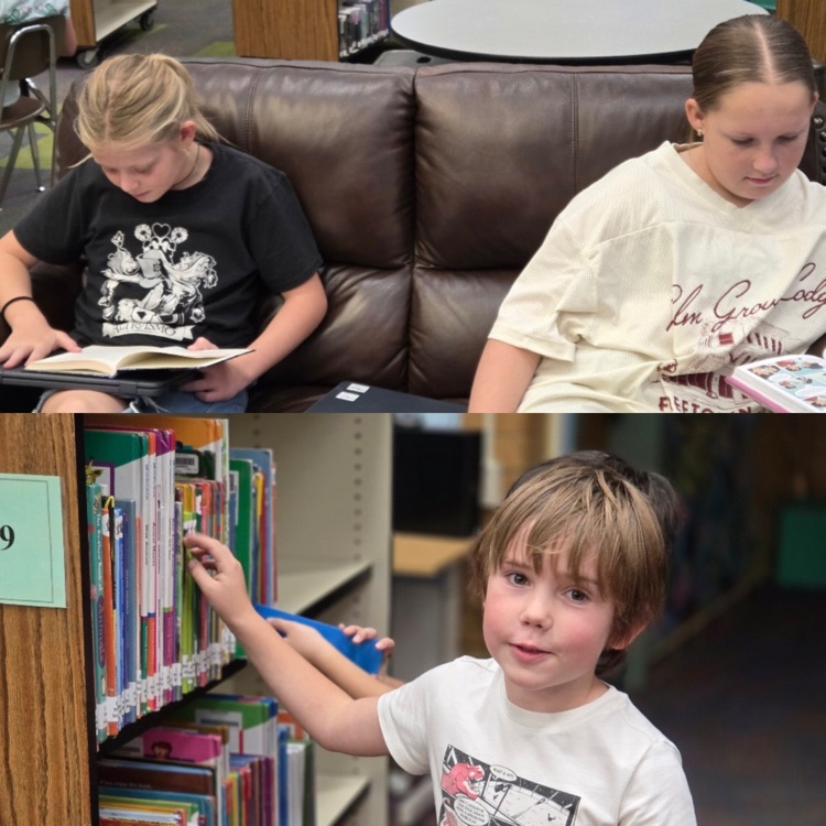 students reading and picking books