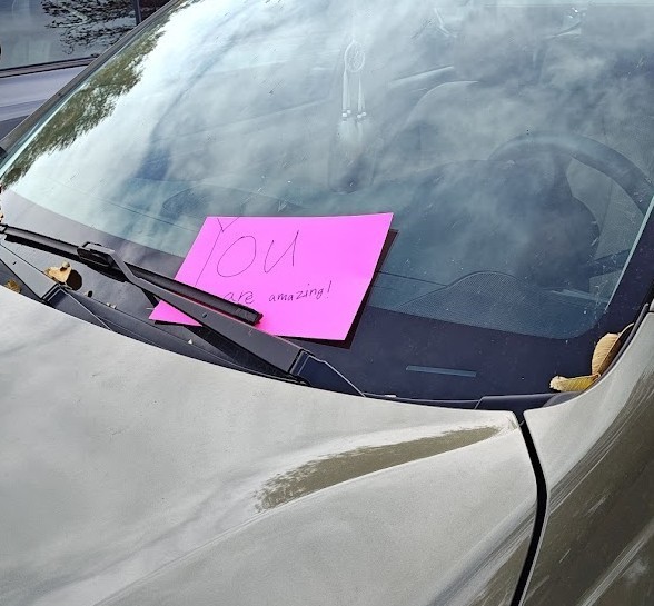 Kind Flyer on Car Windshield