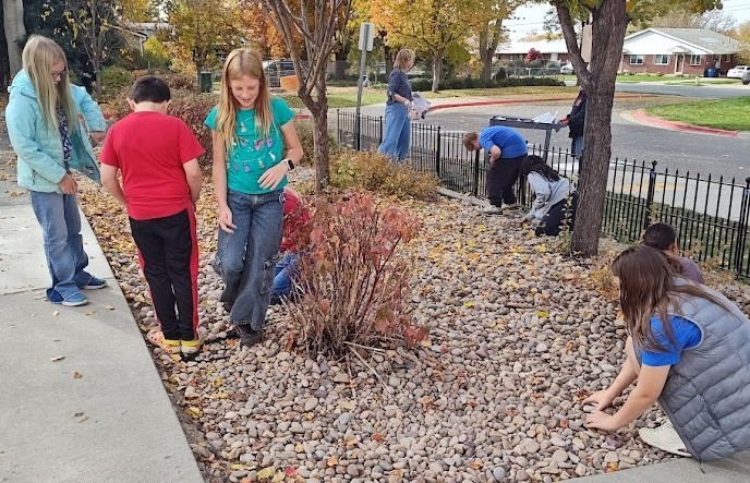 Students helping the flower beds.