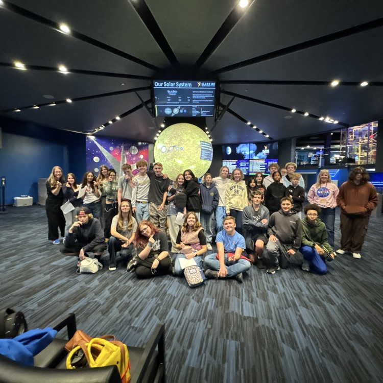 students exploring the planetarium exhibits
