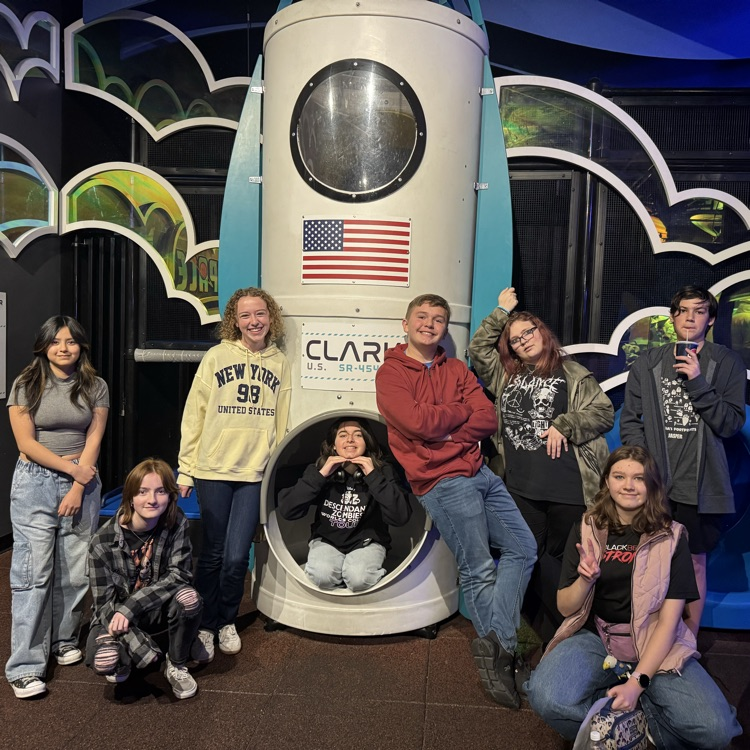 students exploring the planetarium exhibits