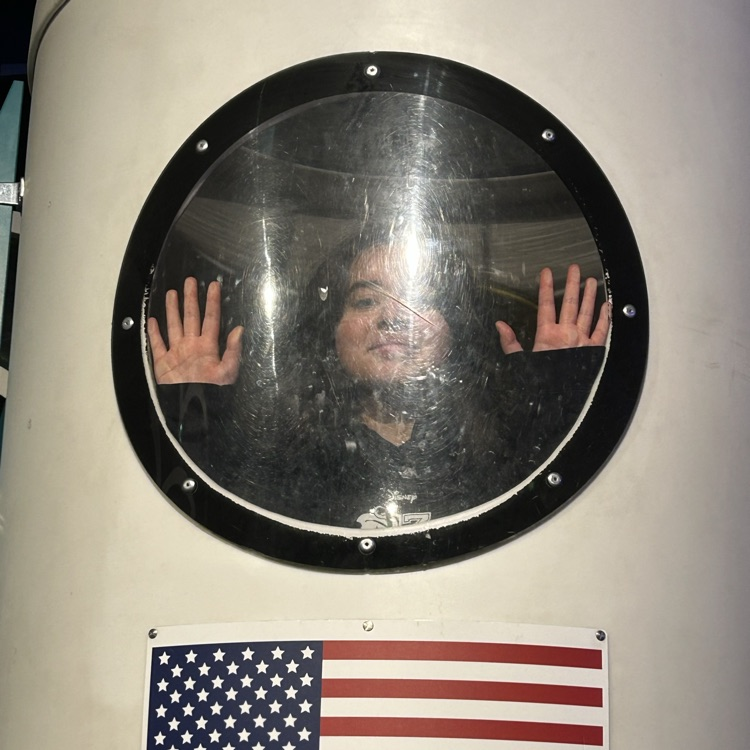 students exploring the planetarium exhibits