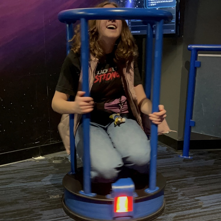 students exploring the planetarium exhibits