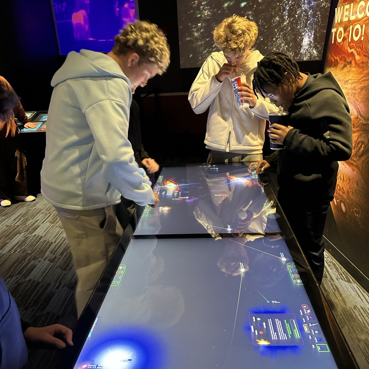 students exploring the planetarium exhibits