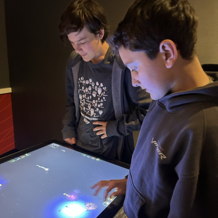 students exploring the planetarium exhibits