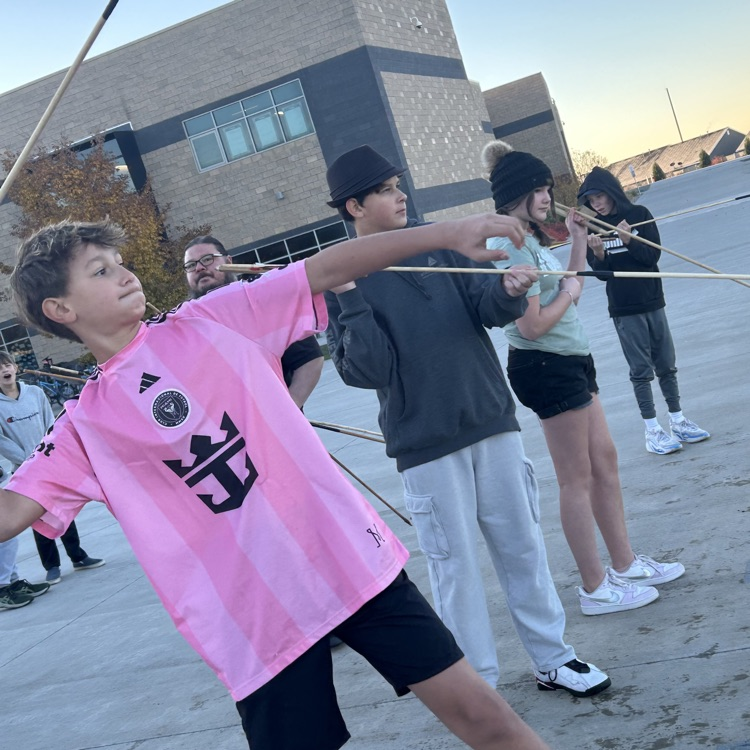 Students learning the atlatl.