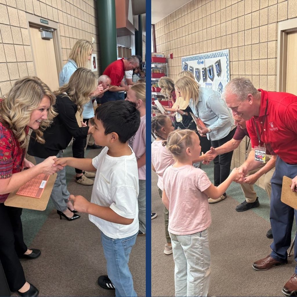 Students shaking hands with adult volunteers in the Amazing Shake Competition.
