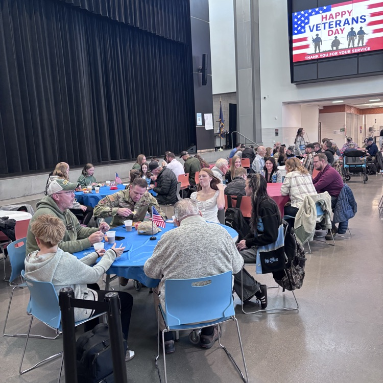students visiting with veterans