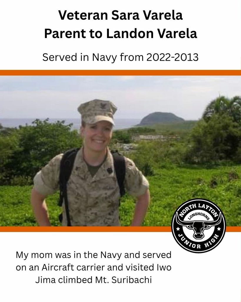 Woman in military uniform standing in Japan with green and water in the background 