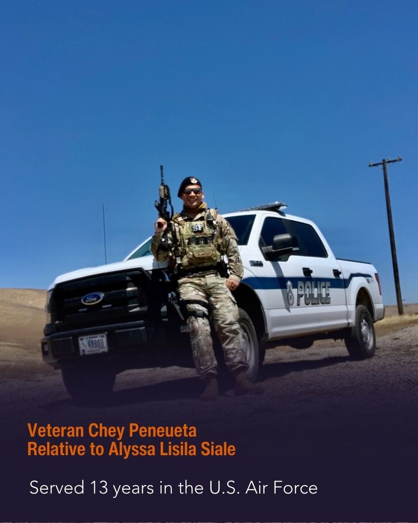 Policeman standing in uniform in front of his truck outside