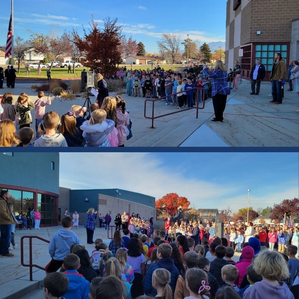 Students gather around an American Flag outside for a flag raising ceremony.