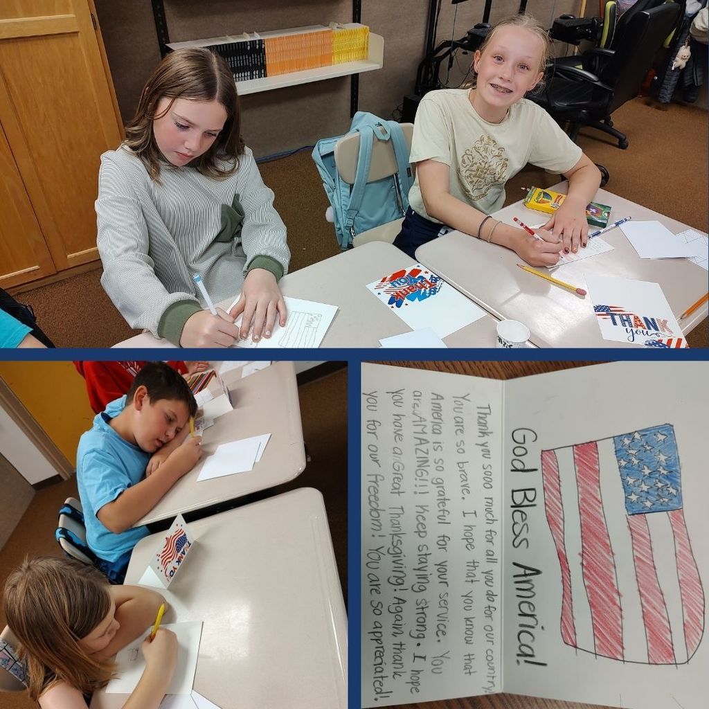 Students writing cards with patriotic pictures drawn for Veteran's Day.