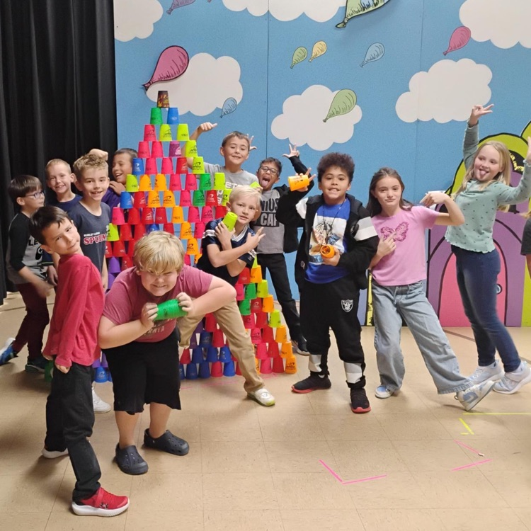Students stacking cups