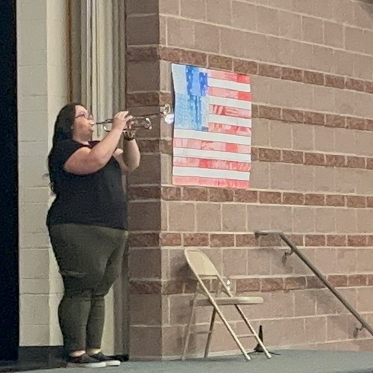 teacher playing taps