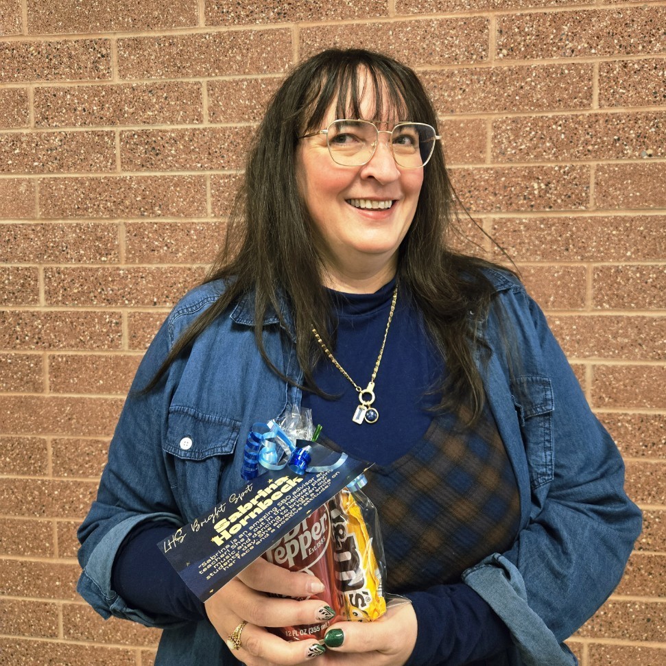 Mrs. Bargar holding her Bright Spot Award