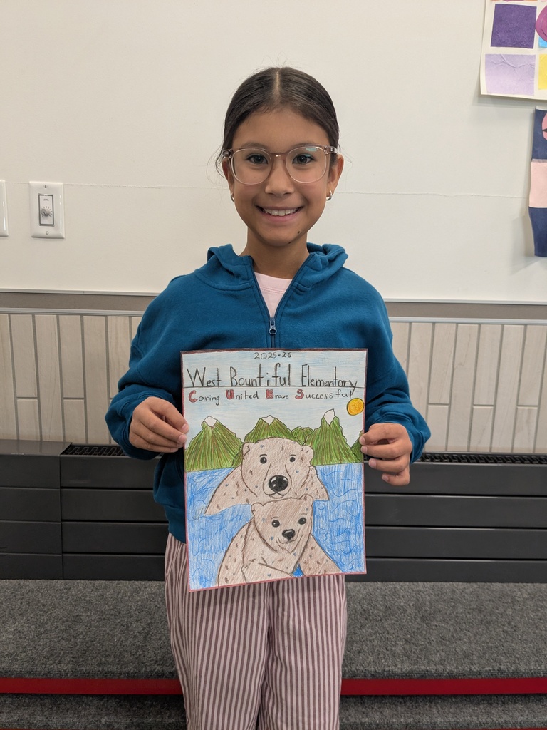 Isabel Kim- Winner of this year's yearbook cover contest. She is holding her yearbook cover art.