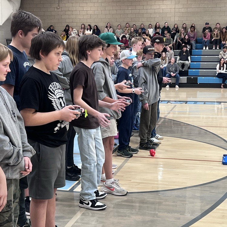 Robotics students drive their robots.