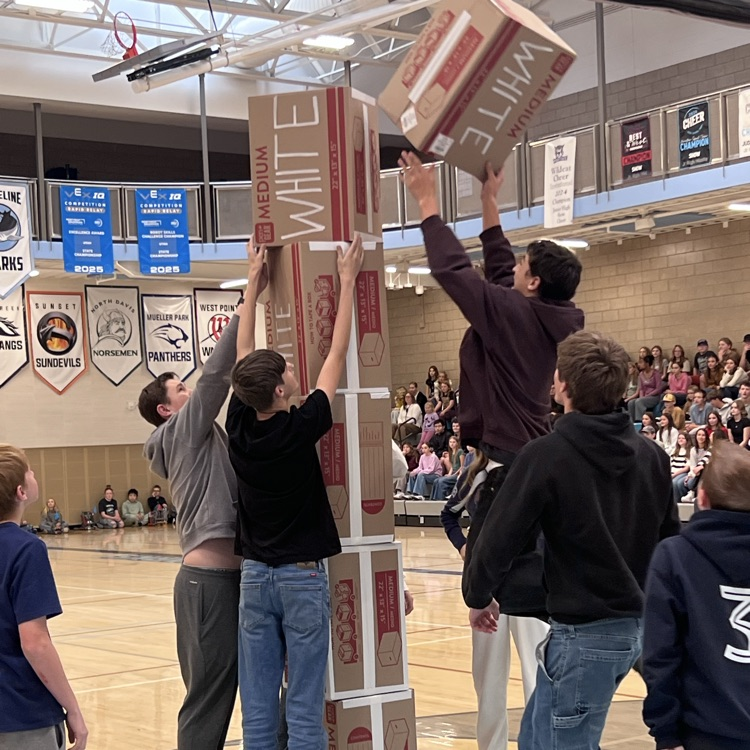 A student gets air stacking a box.