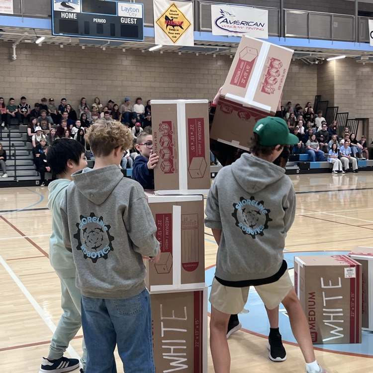Robotics team races to stack boxes first.