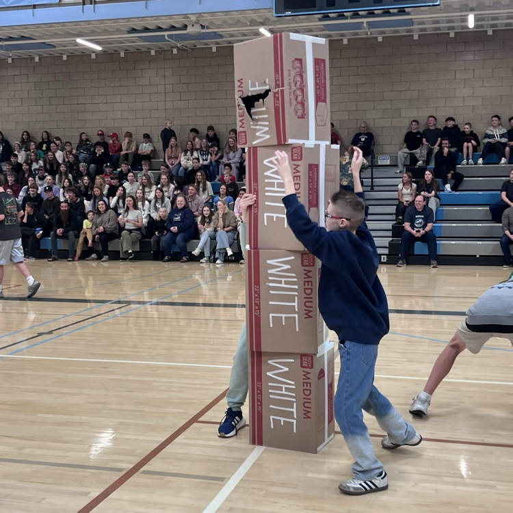 Robotics team races to stack their boxes first.