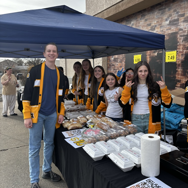 students at the bake sale tent 