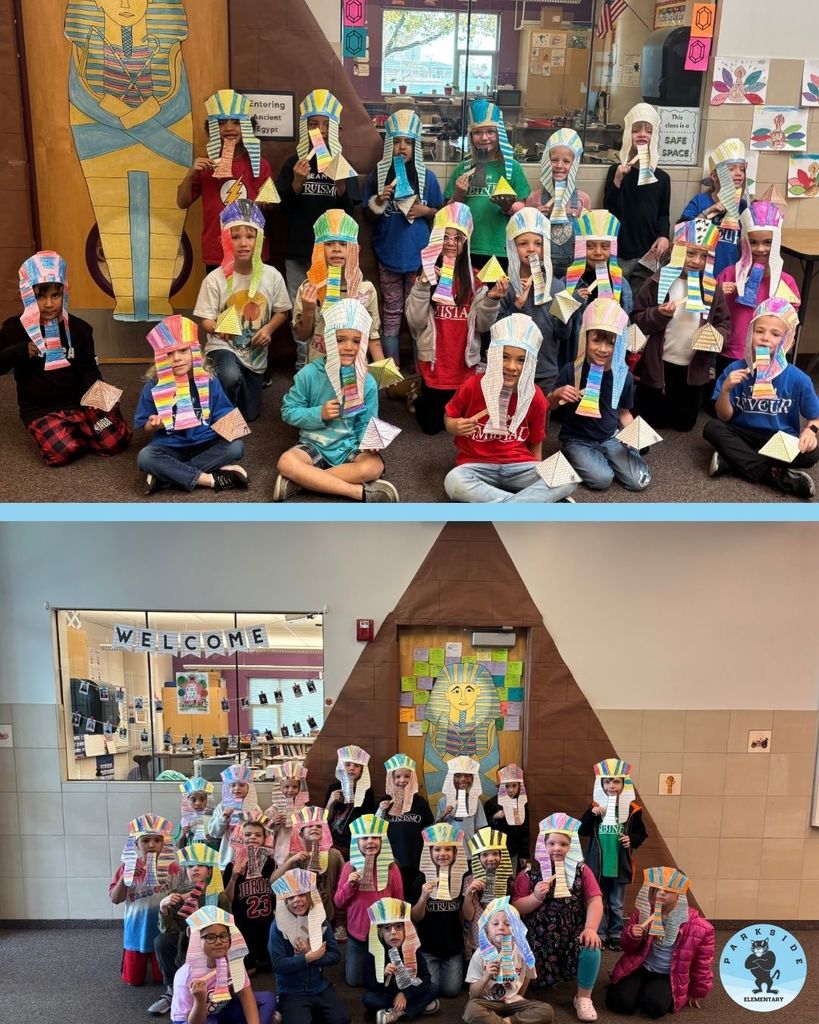 1st grade students dressed as Egyptian Pharoahs in front of their classrooms.