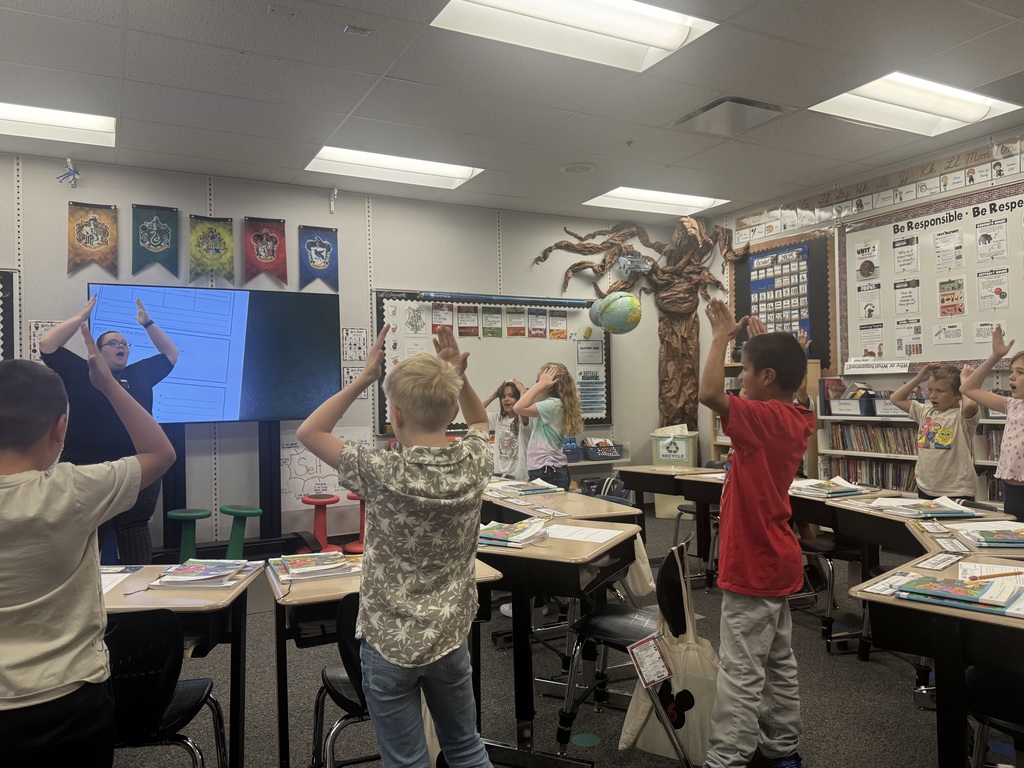 Students and teacher doing movements for srsd