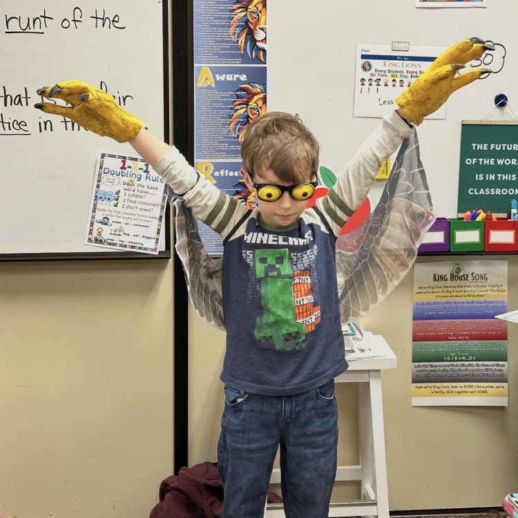 student showing a bird’s wings