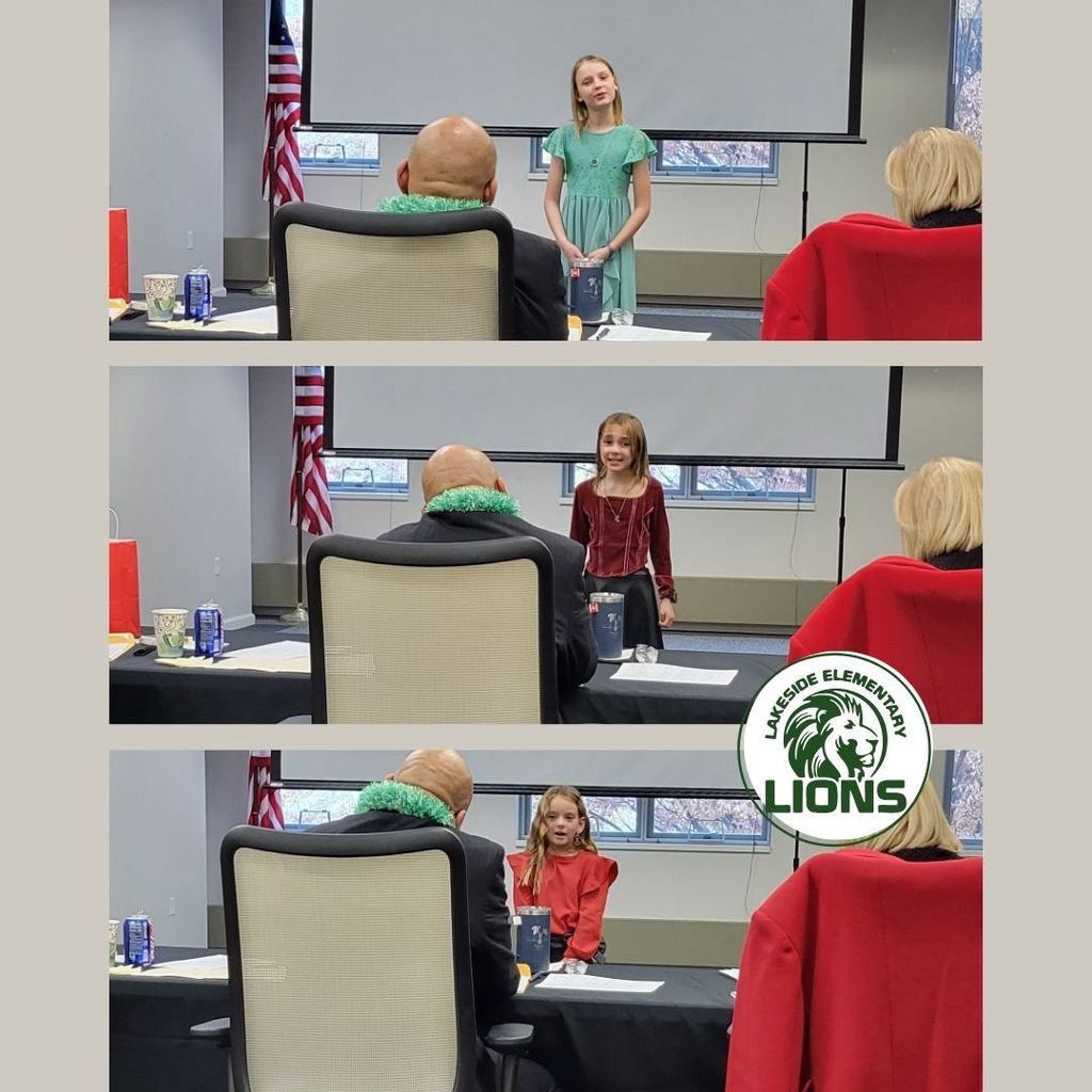 Students standing in front of judges presenting speeches.