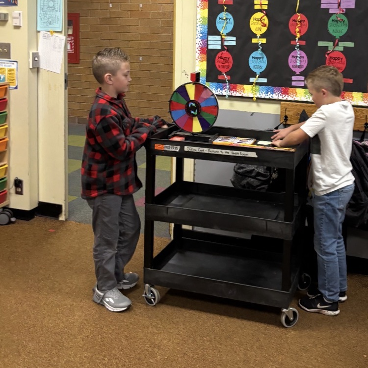 students with prize cart as they go around to classes