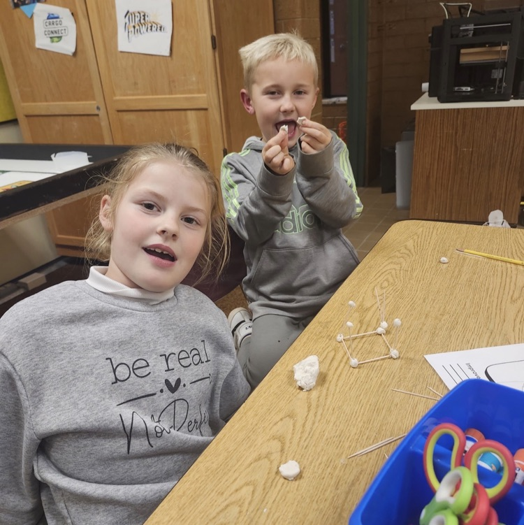 2nd graders posing with their turkey trap engineering process