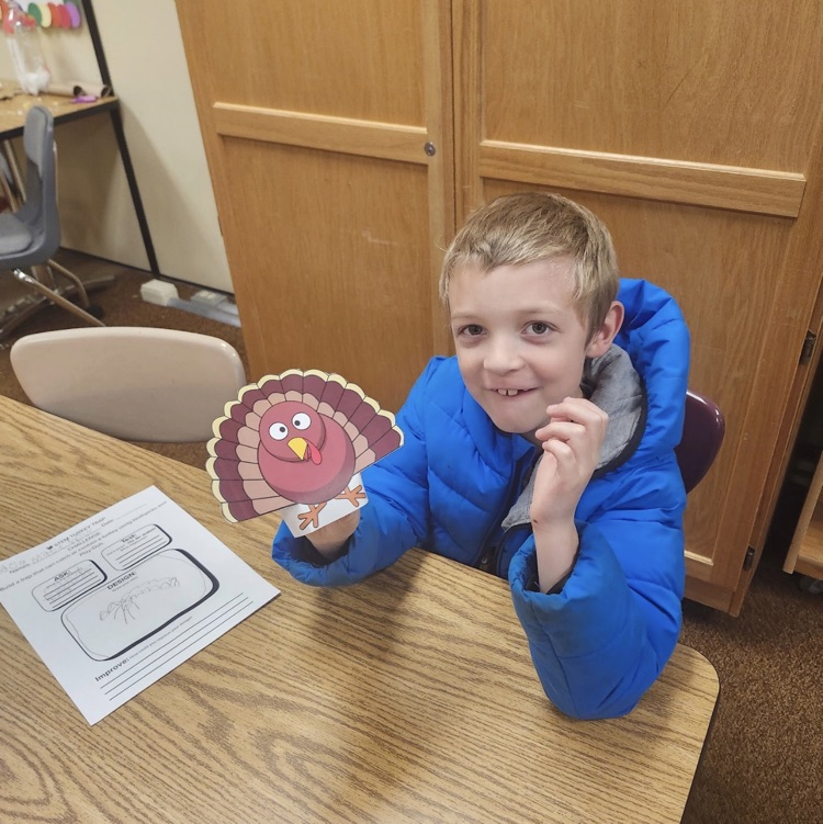 2nd graders posing with their turkey trap engineering process