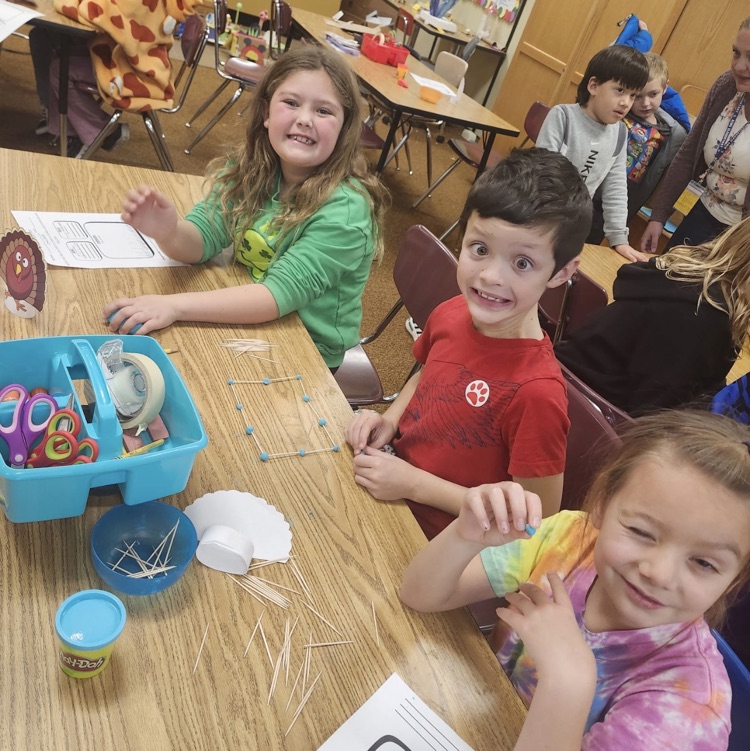 2nd graders posing with their turkey trap engineering process