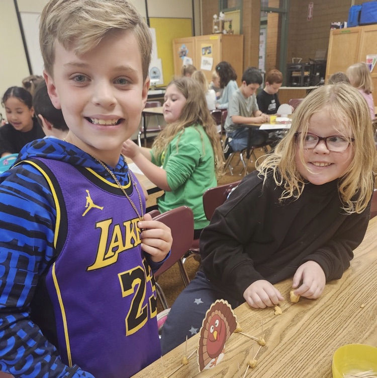 2nd graders posing with their turkey trap engineering process