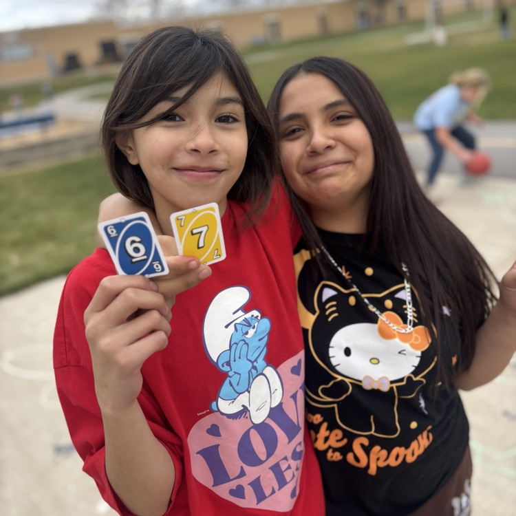 Students holding 6-7 uno cards!