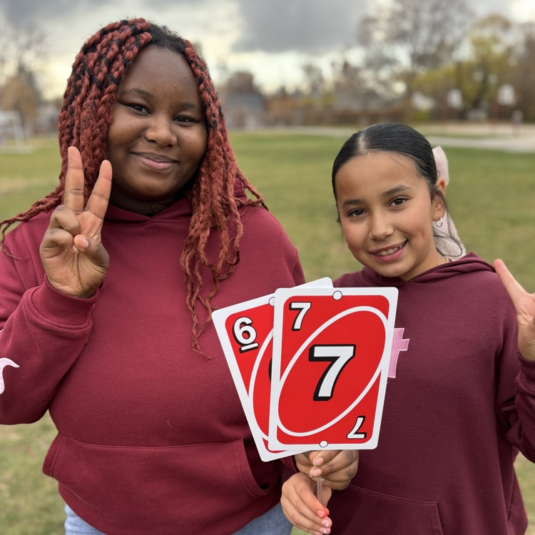 Students holding 6-7 uno cards!