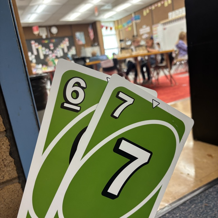 6-7 uno cards in front of classroom