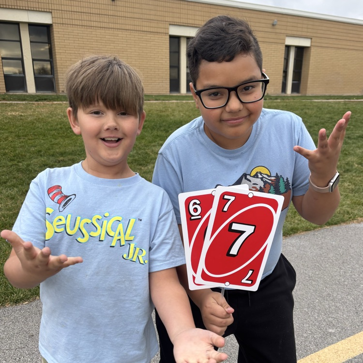 Students holding 6-7 uno cards!