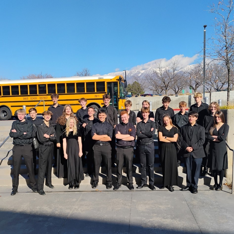 jazz Band students standing in front of the bus