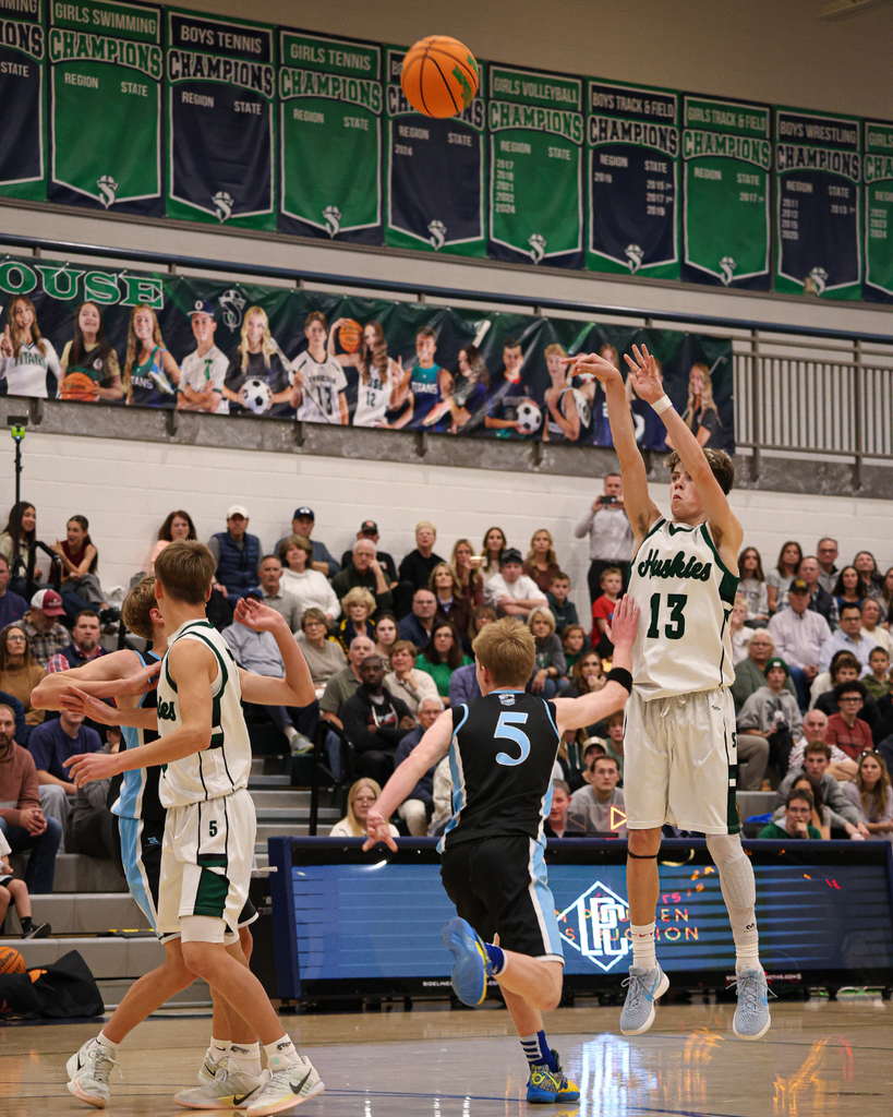 A Farmington Junior High player jumps to shoot a three-pointer at the Davis School District Boys Basketball Championship Game. 