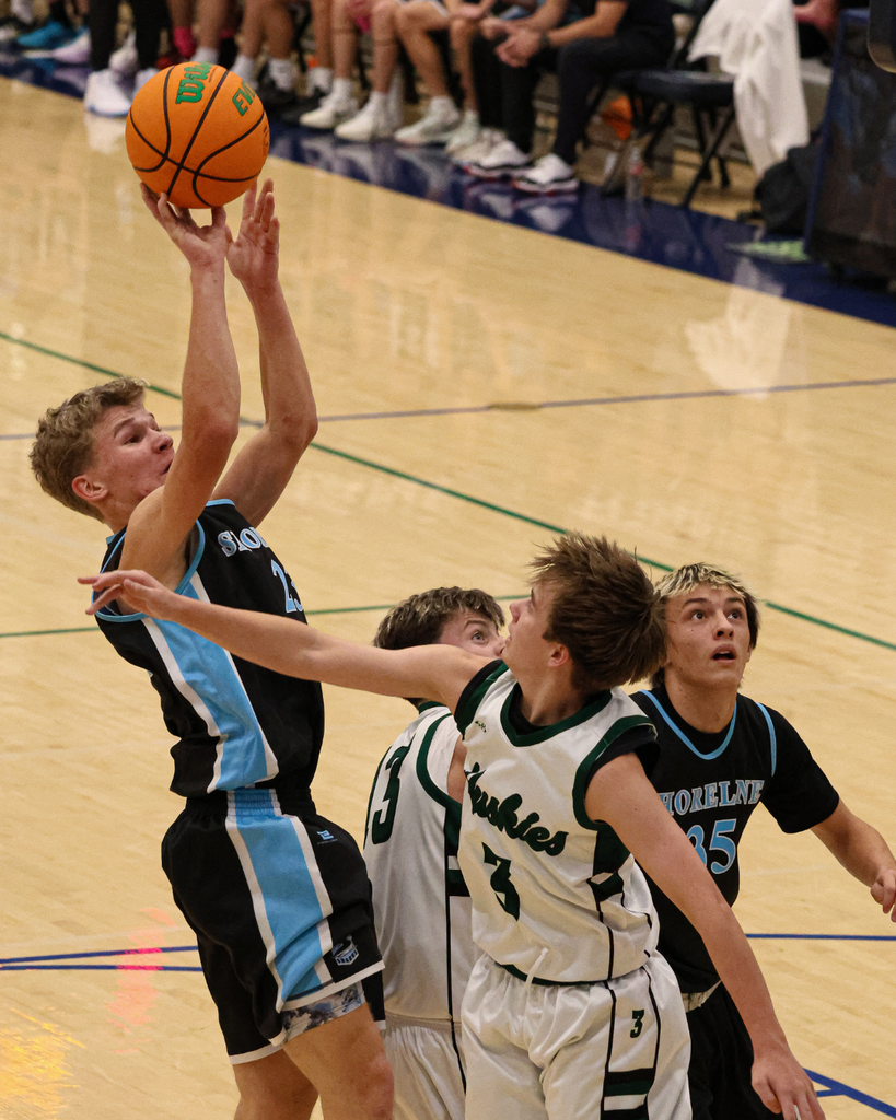 A Shoreline Junior High player jumps back to shoot at the Davis School District Boys Basketball Championship Game. 