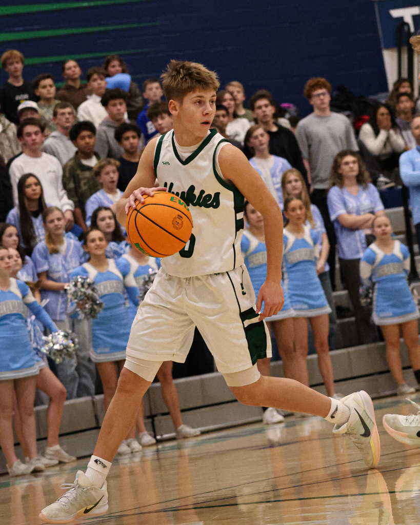 A Farmington Junior High student dribbles the ball at the Davis School District Boys Basketball Championship Game. 