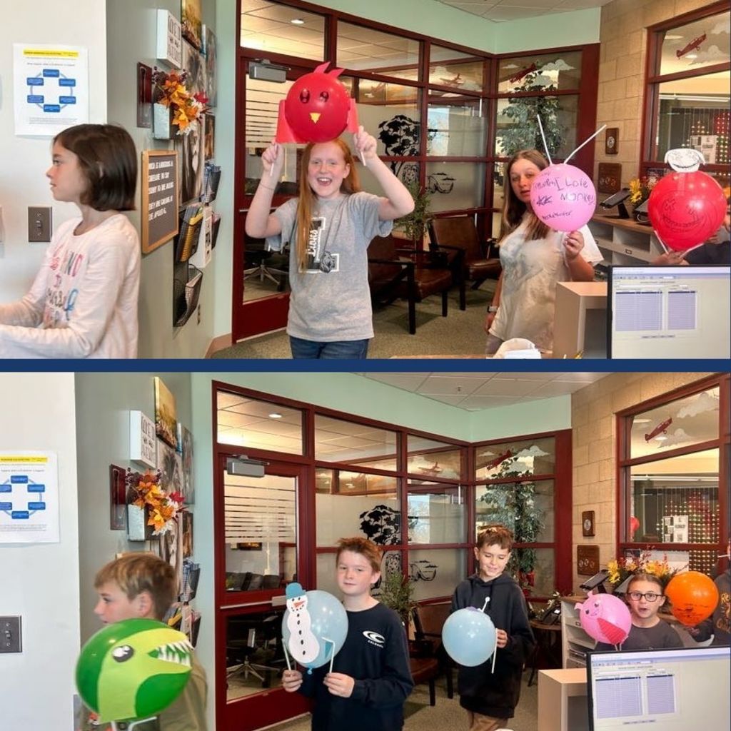 Students holding Balloons they decorated for Thanksgiving.