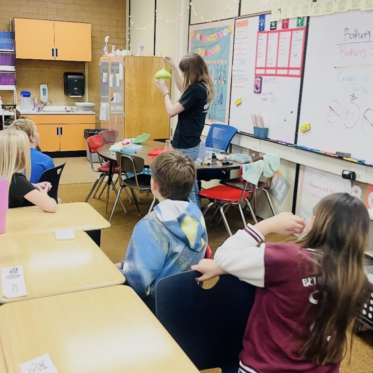 students receiving a demonstration on states of matter