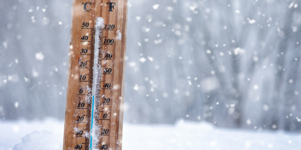 Image of cold snowy weather with a temperature gauge