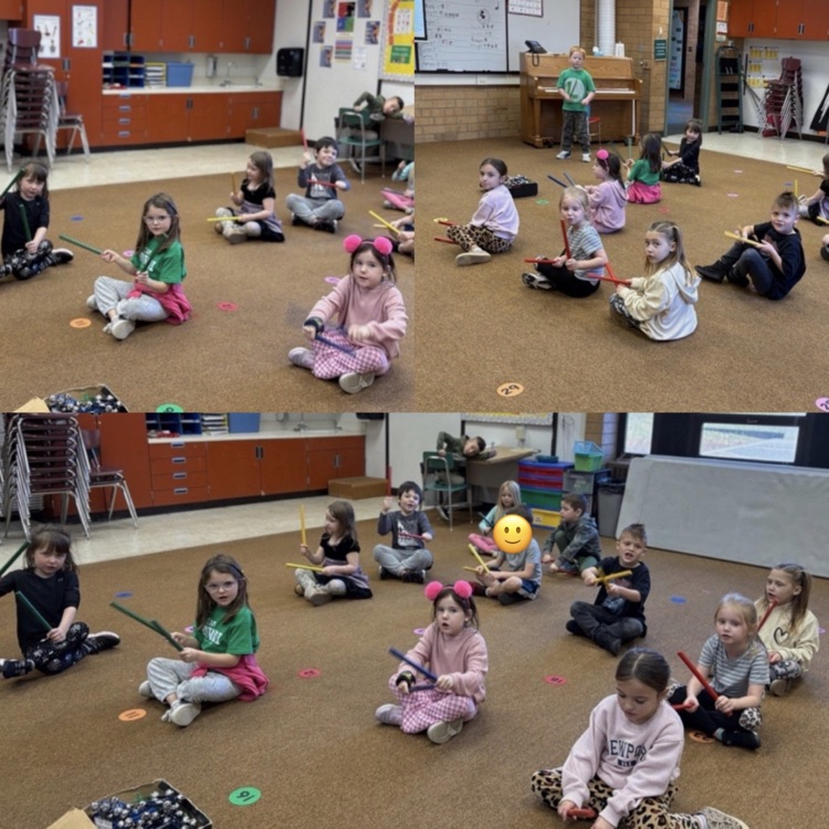 kindergarten students learning to play a song with instruments