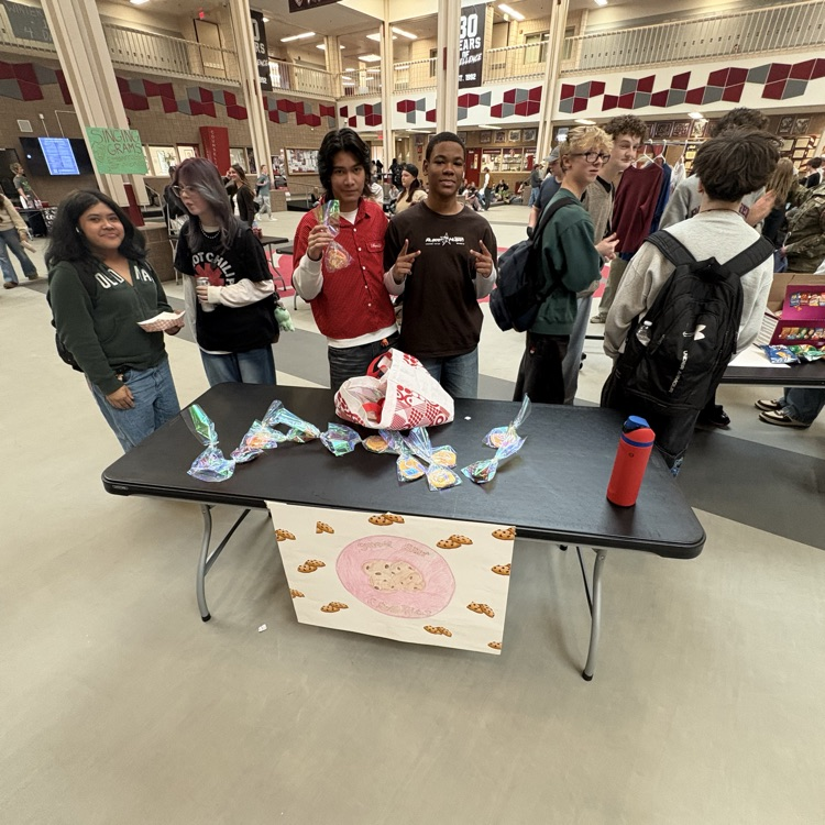 Students selling for the business fair.